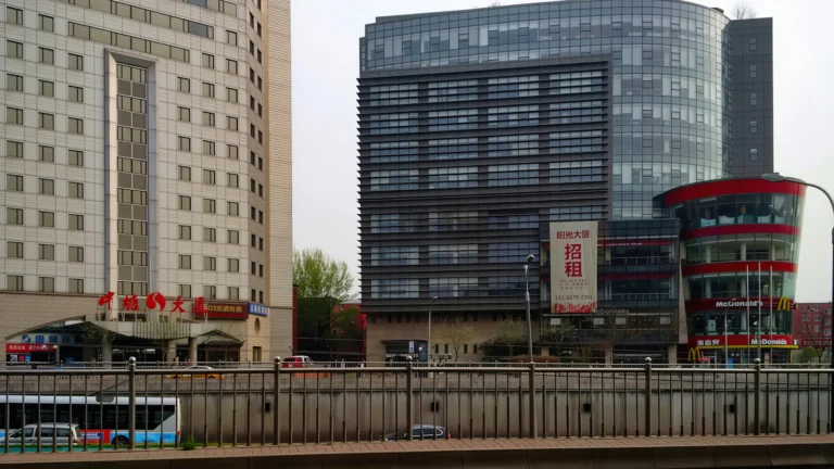 Commercial buildings and shops along a busy city street