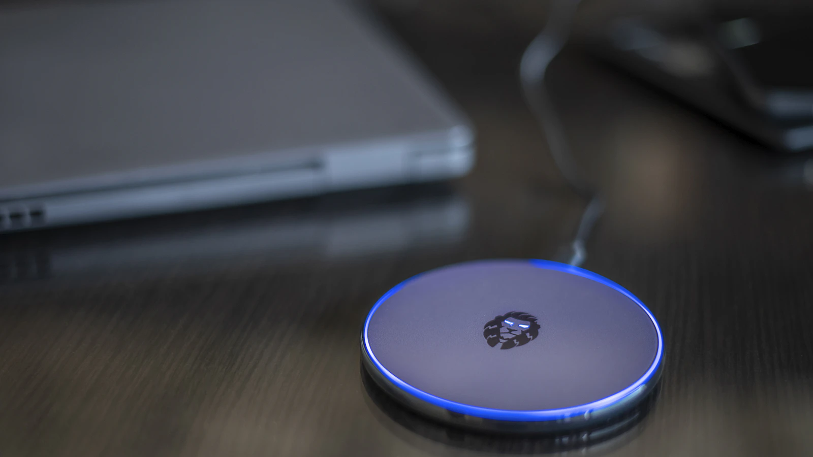 A smartphone charging on a wireless charger