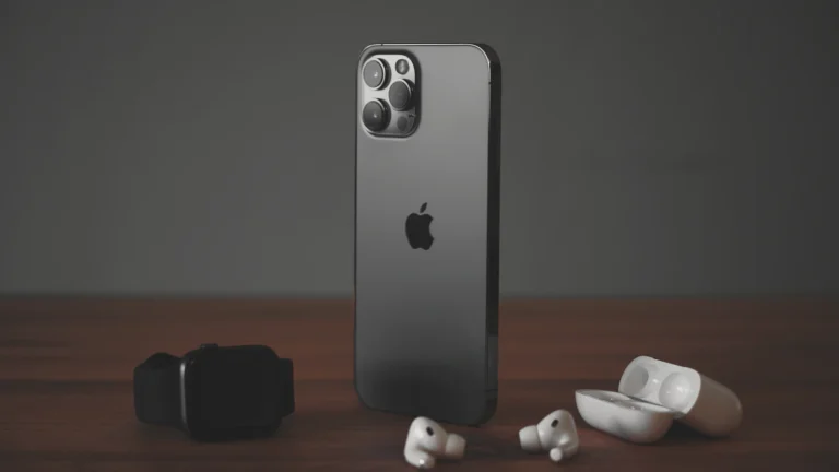 An iPhone with AirPods Pro and an Apple Watch