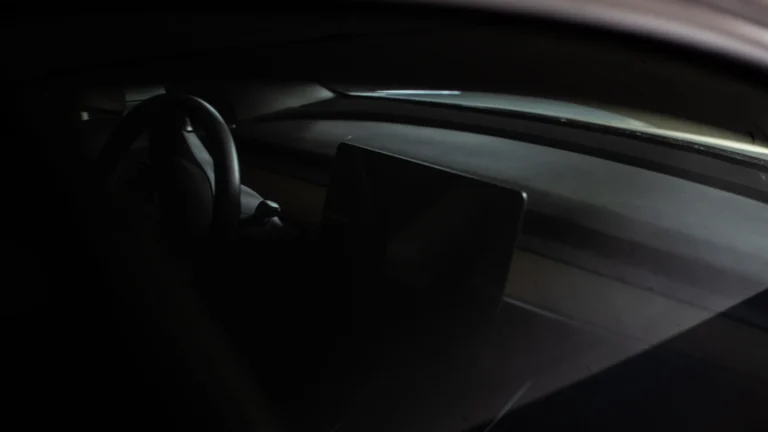 The interior of a modern car with a steering wheel and dashboard