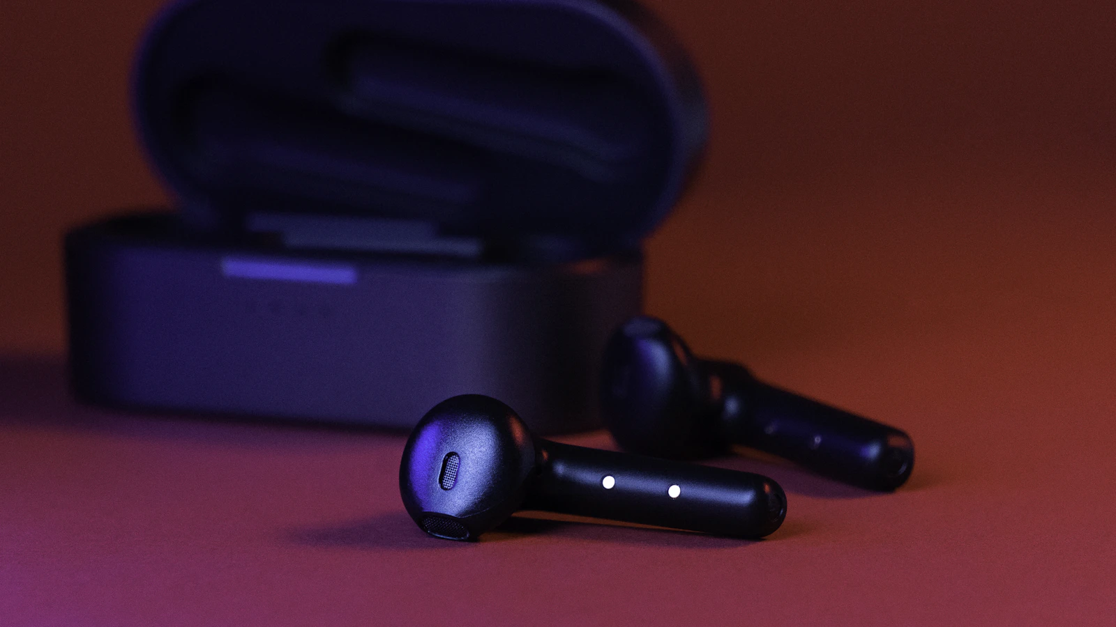 Close up of black true wireless earbuds